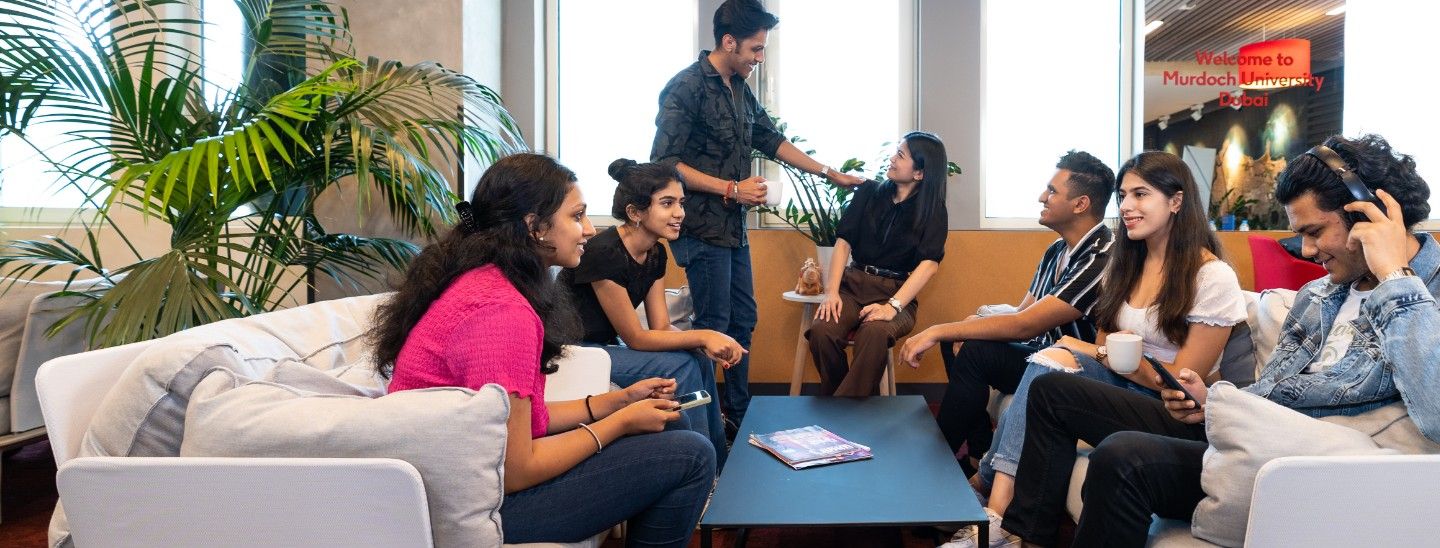 Student group relaxes in reception area