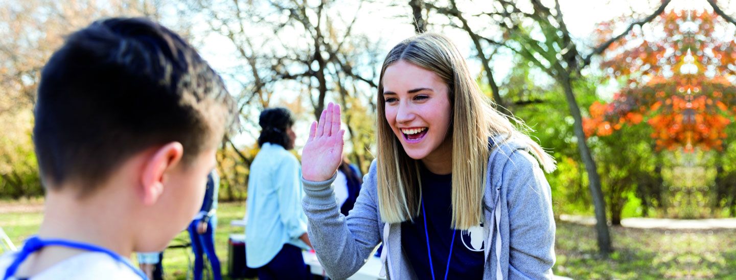Students highfiving